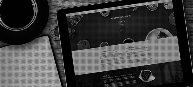 ipad with coffee empire homepage
